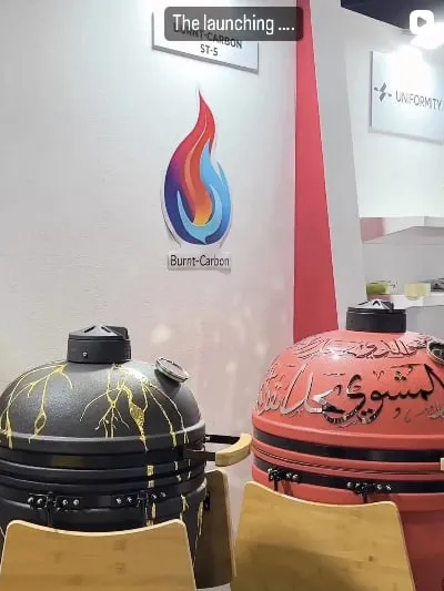 Kintsugi black and calligraphy red kamados on the Burnt Carbon stand at its launch